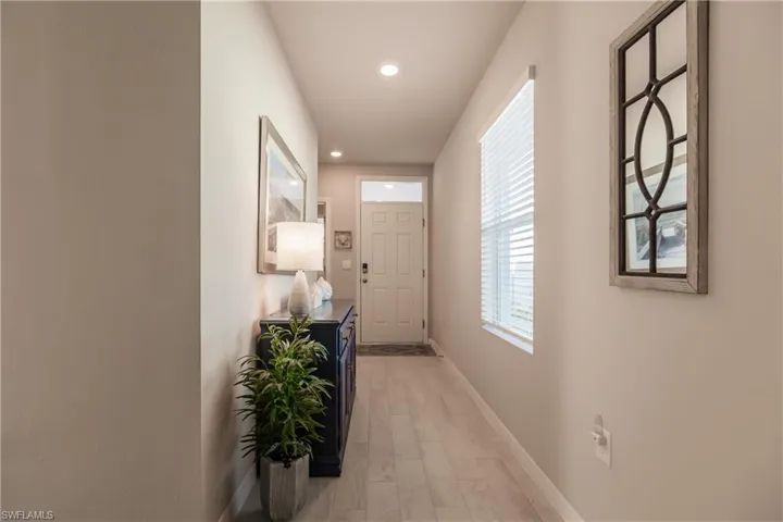 Hall featuring light wood-type flooring