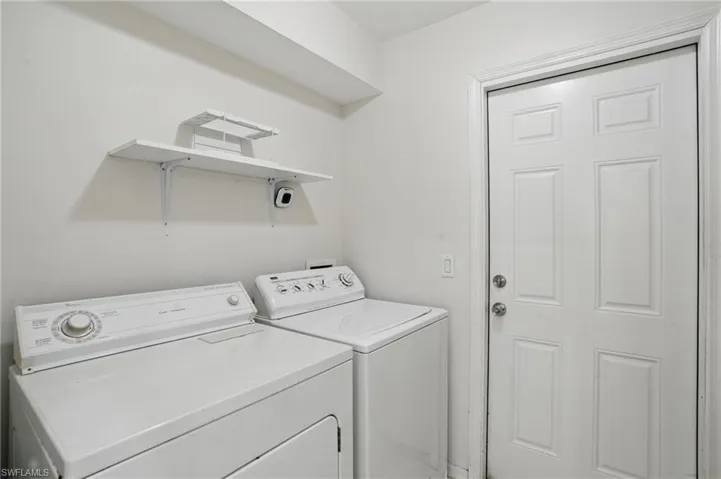 Laundry area featuring washer and clothes dryer and laundry area