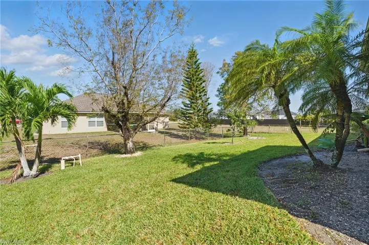 View of yard featuring fence