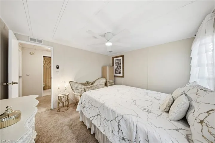 Bedroom with carpet and a ceiling fan
