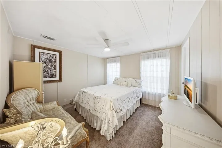 Bedroom with carpet and ceiling fan