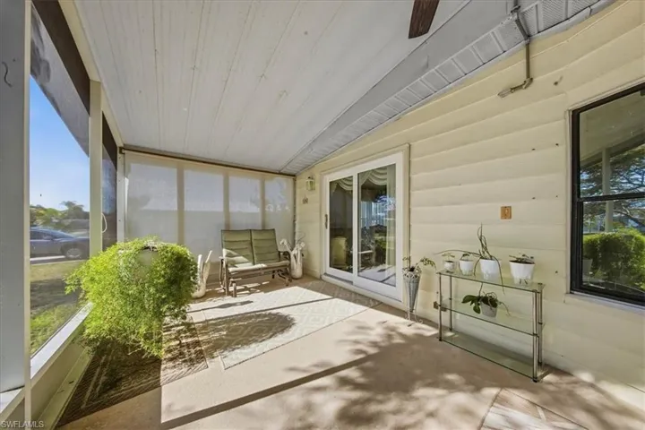 Sunroom / solarium with plenty of natural light and a ceiling fan