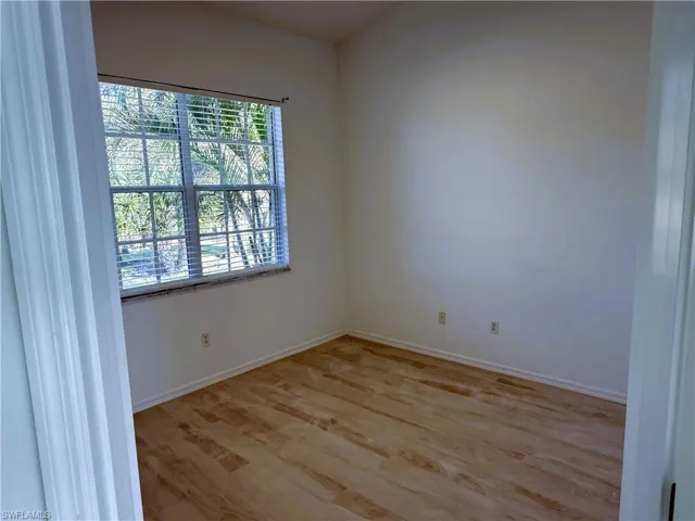 Unfurnished room featuring light wood-type flooring and baseboards
