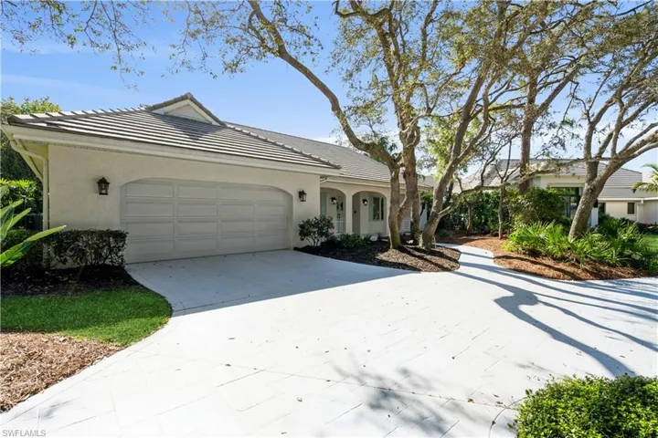 Single story home with a garage