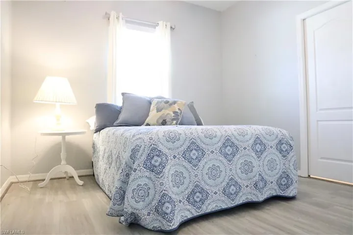 Bedroom with hardwood vinyl floors