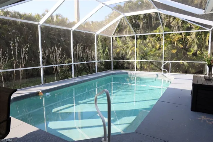 View of pool featuring a patio area and a lanai