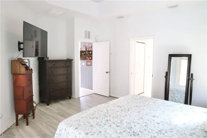 Owners Suite with tray ceilings, and his/her walk-in closets