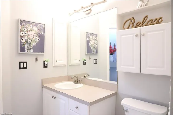 Pool Bathroom with vanity and toilet
