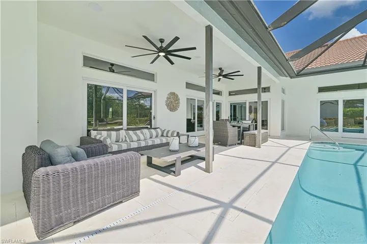 View of patio / terrace with ceiling fan and outdoor lounge area