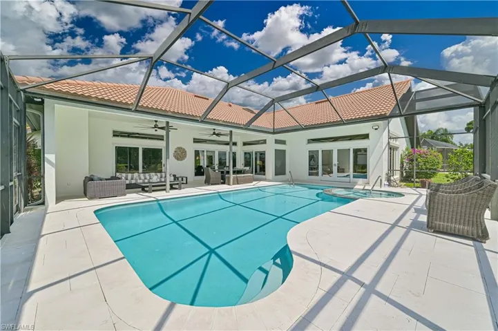View of pool featuring ceiling fan, a lanai, and a patio