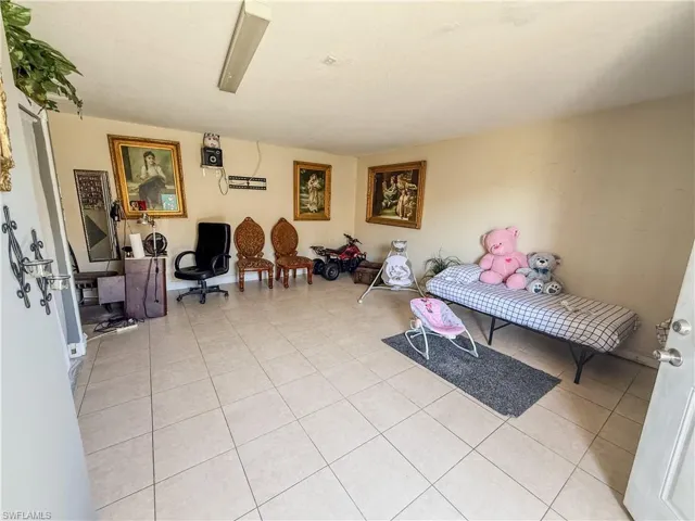 Sitting room with light tile patterned floors