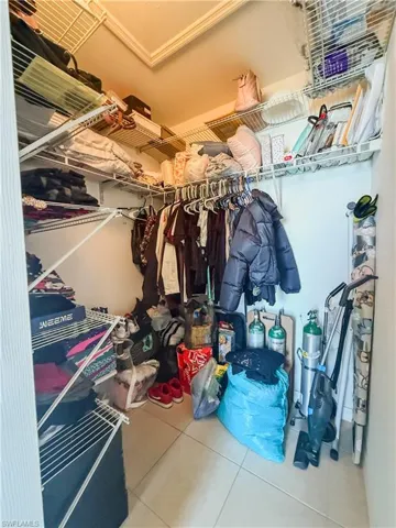 Spacious closet with tile patterned flooring