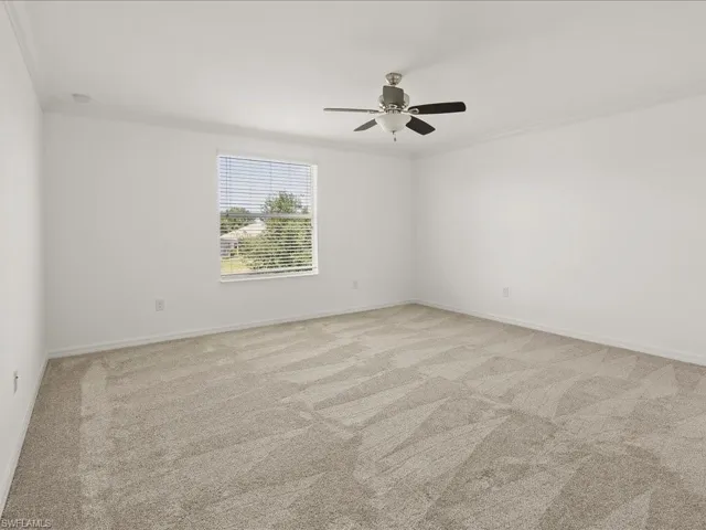 Primary bedroom is huge with a walk in closet and brand new flooring.