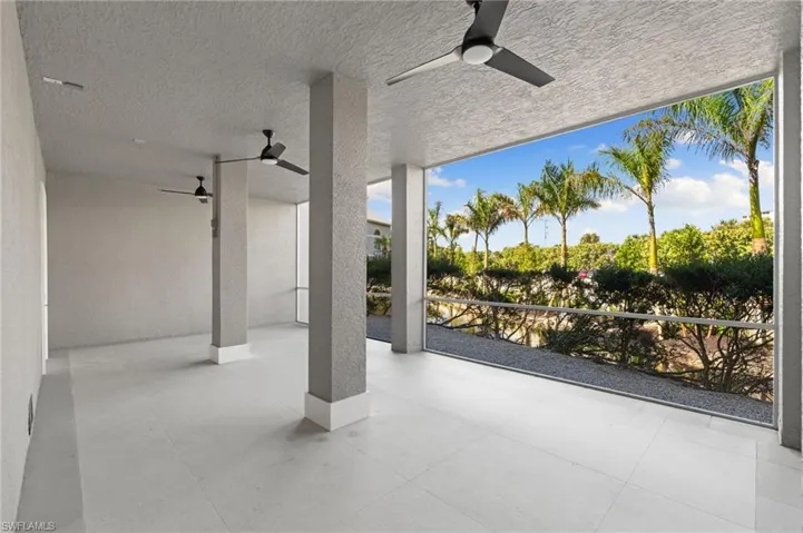View of patio featuring ceiling fan