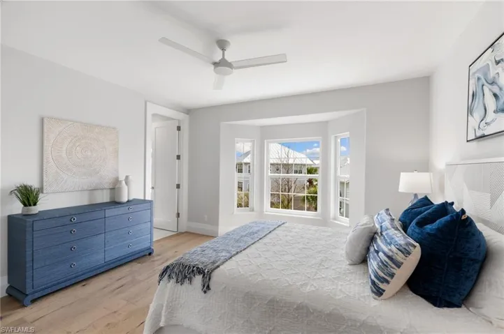 Bedroom with light wood-type flooring and ceiling fan