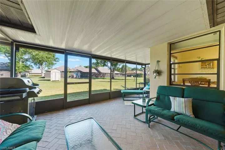 Sunroom featuring wood ceiling