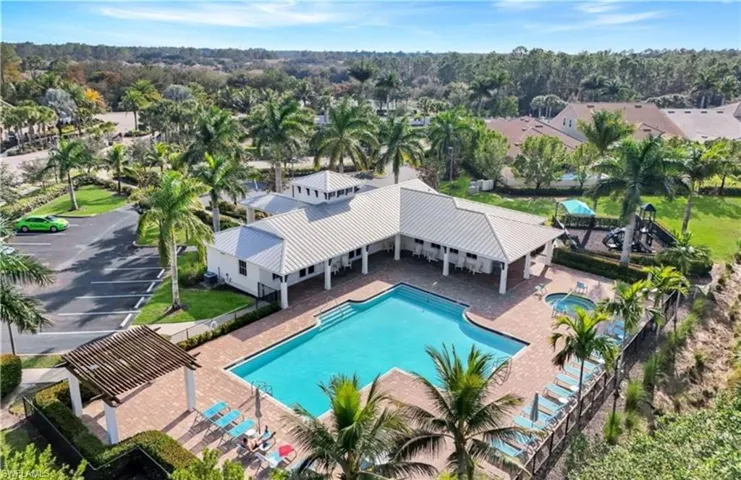 Community pool featuring a patio area and a pergola