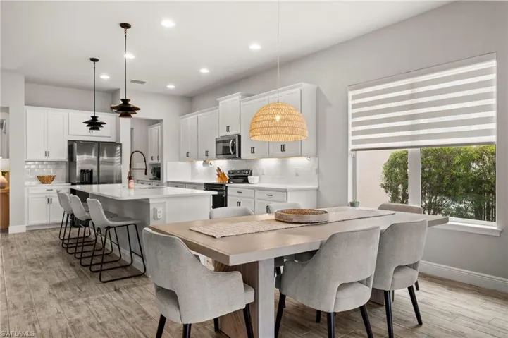 Dining space featuring recessed lighting and tile flooring