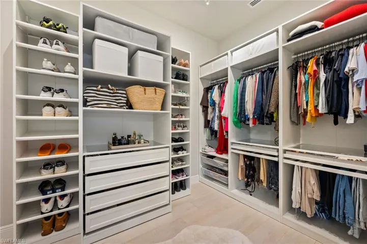Walk in closet with built-in shelving