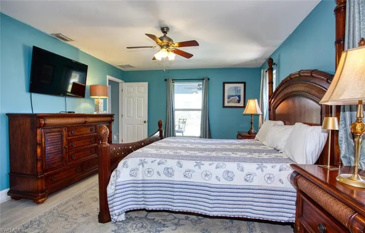 Bedroom with a ceiling fan and light wood finished floors
