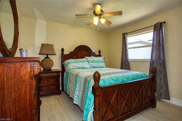 Bedroom featuring ceiling fan and light wood finished floors