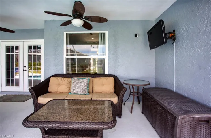 View of patio with french doors, a ceiling fan, and outdoor lounge area