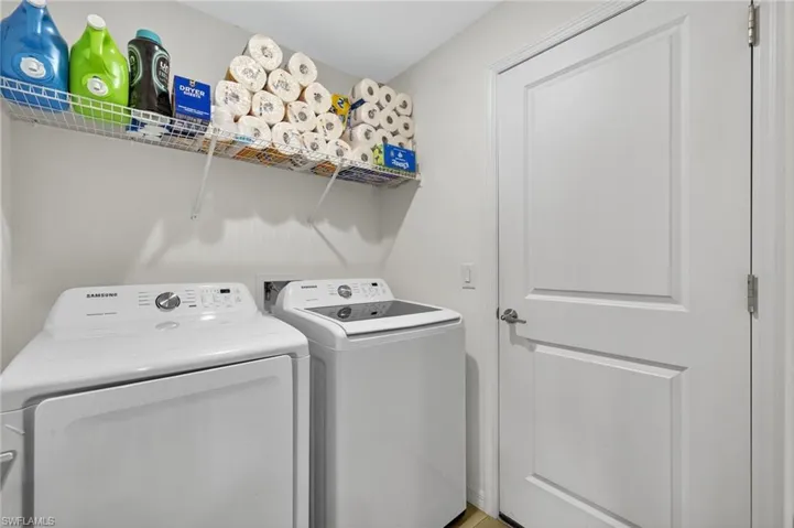 Laundry room featuring separate washer and dryer
