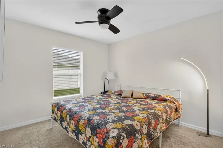 Bedroom featuring carpet floors and a ceiling fan