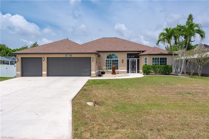 Ranch-style home with stucco siding, a garage, concrete driveway, and a shingled roof