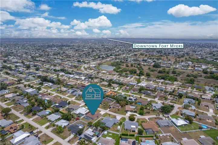 View of property location with nearby suburban area