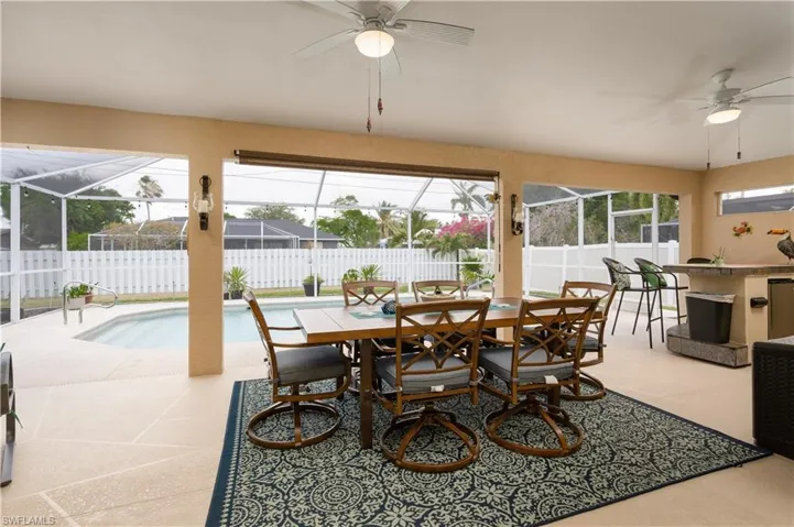 Dining area featuring a ceiling fan and a sunroom