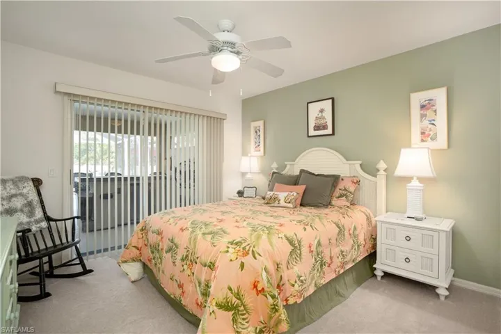 Bedroom featuring carpet, a ceiling fan, access to exterior, and baseboards