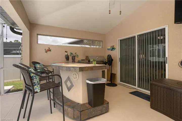 View of patio featuring exterior kitchen and area for grilling
