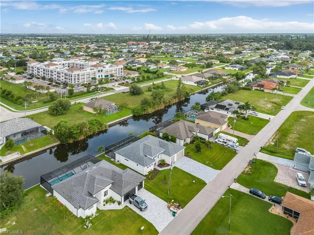 Aerial perspective of suburban area with a large body of water