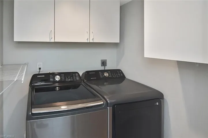Laundry room with NEWER washer and dryer inside unit