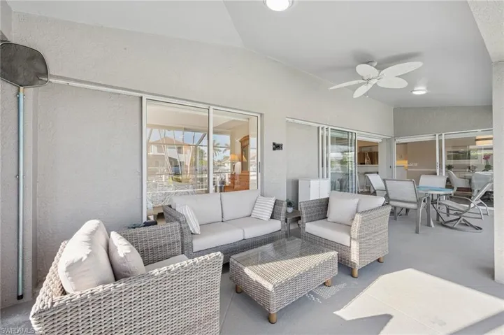 View of patio / terrace with outdoor lounge area, outdoor dining space, and ceiling fan