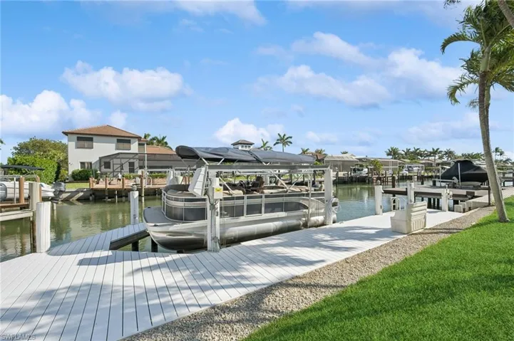 View of dock featuring a water view and boat lift