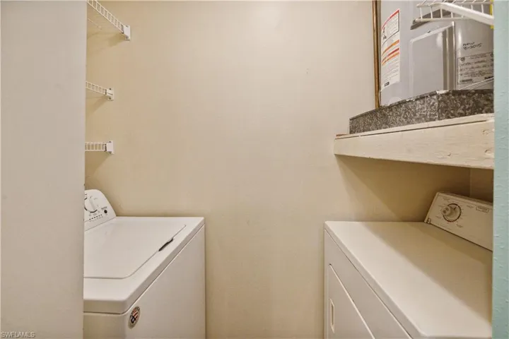 Laundry room featuring washer and clothes dryer and laundry area