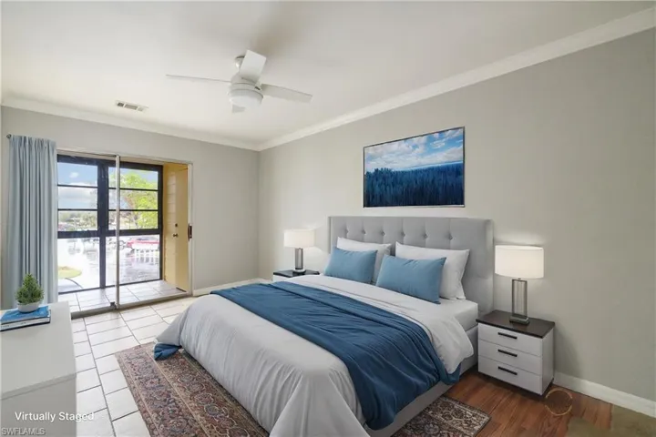 Bedroom with visible vents, crown molding, a ceiling fan, baseboards, and access to exterior