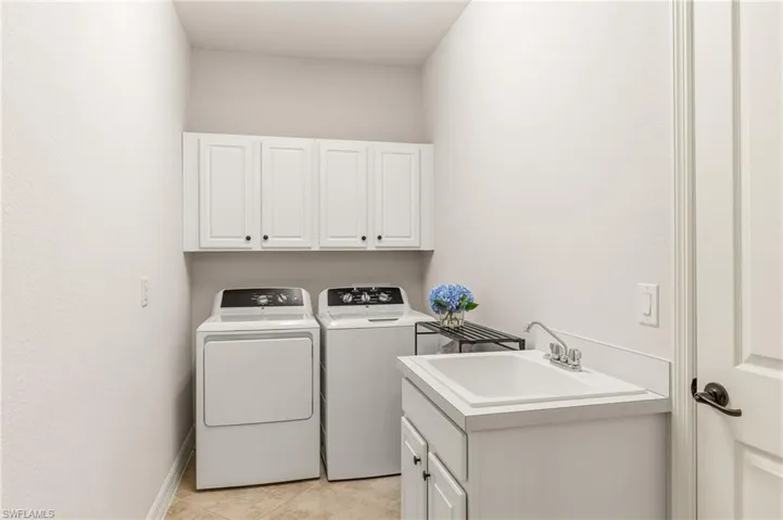 New commercial washer & dryer w/cabinetry & utility sink