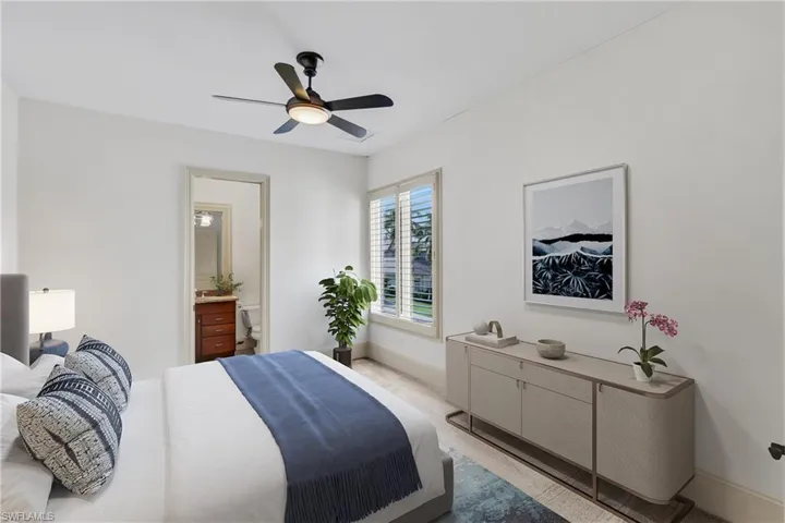 Spacious Guest bedroom #1 with en-suite bathroom and plantation shutters!- Virtually Staged
