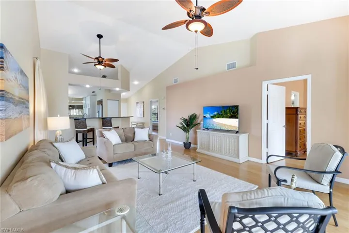 Expansive 24-foot great room offered fully furnished, including television and décor