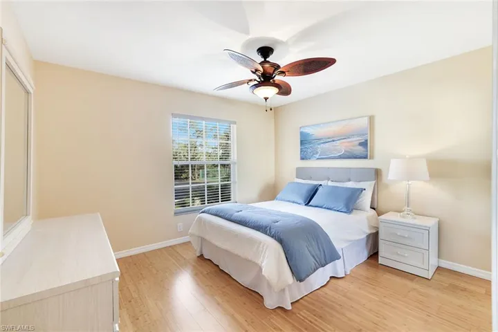 Furnished guest suite includes a pocket door for private en-suite bath access
