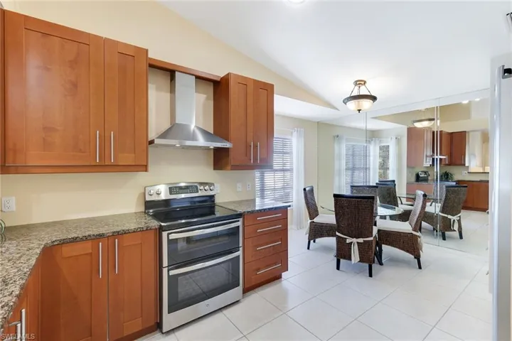 Updated kitchen featuring 42-inch soft-close wood cabinetry and tile flooring