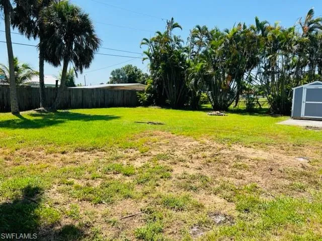 View of yard featuring a storage shed