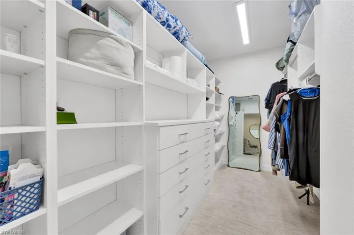 Primary suite features a huge walk-in closet has been thoughtfully renovated.