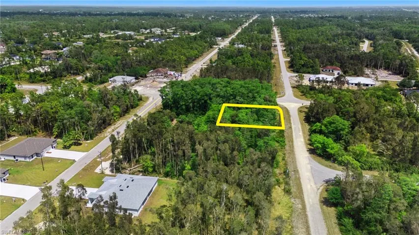 Drone / aerial view featuring a forest view and a residential view