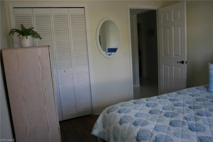Bedroom with a closet and wood finished floors