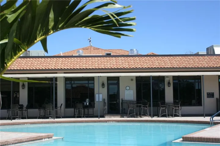 Community pool featuring a patio with waitstaff service