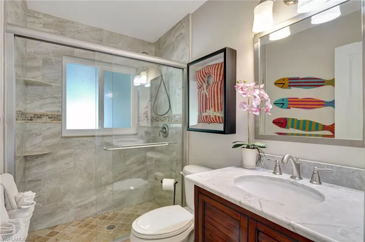 Guest bathroom with a shower stall, and vanity